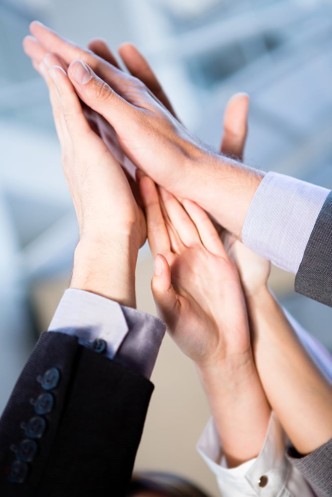 Business celebration for good teamwork with a high-five