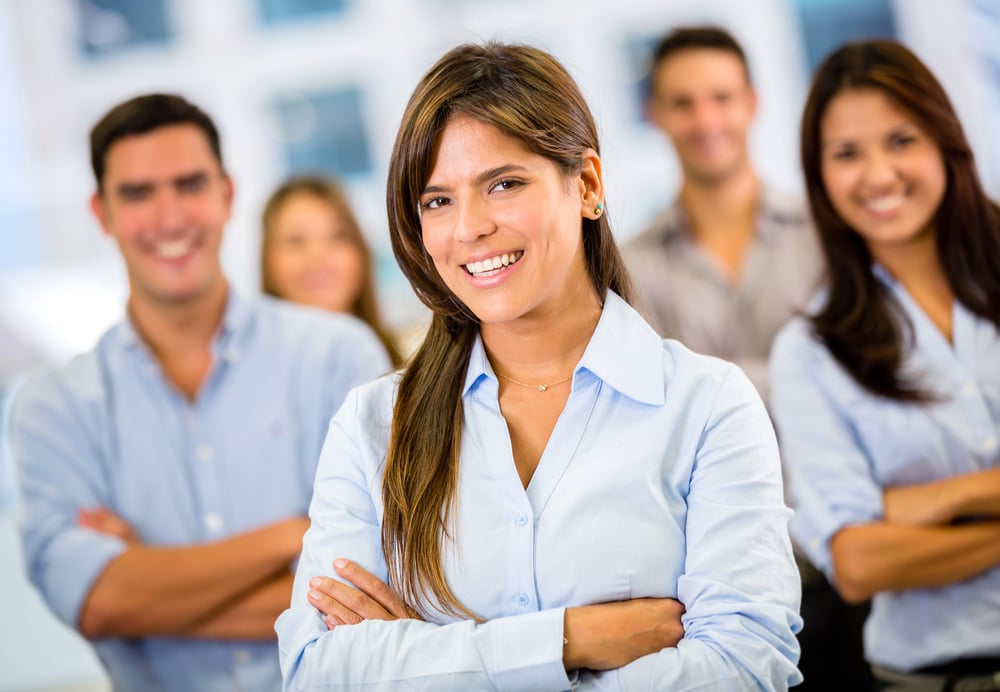 Female business leader with her team at the office