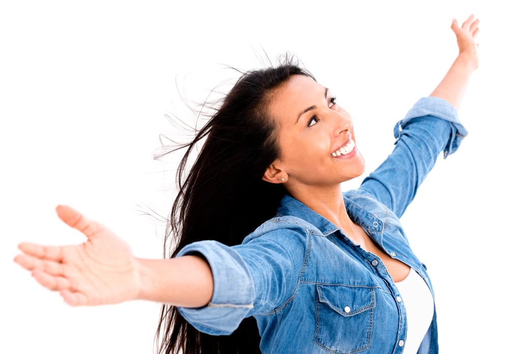 Happy woman with arms open - isolated over a white background